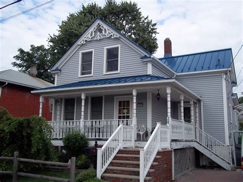 gray house with blue roof